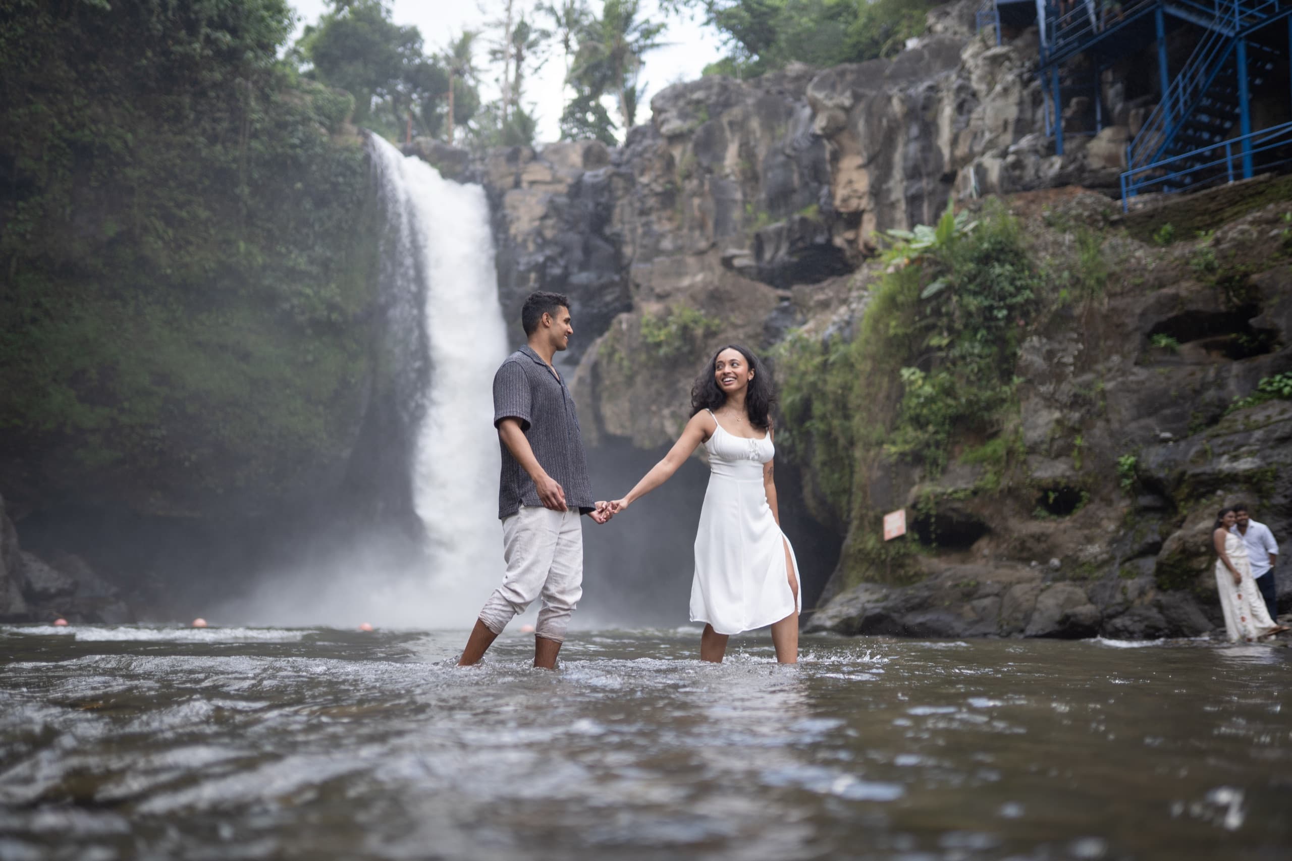 Arry and Michell at a waterfall — a moment on the path ahead